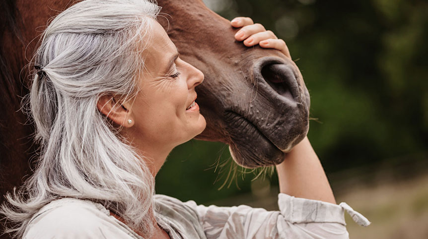 Mature woman with horse