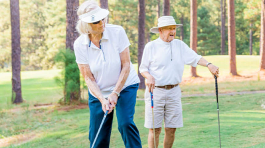 Senior couple golfing on a sunny day